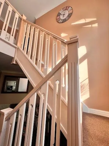 Staircase with spindles and newel posts freshly painted